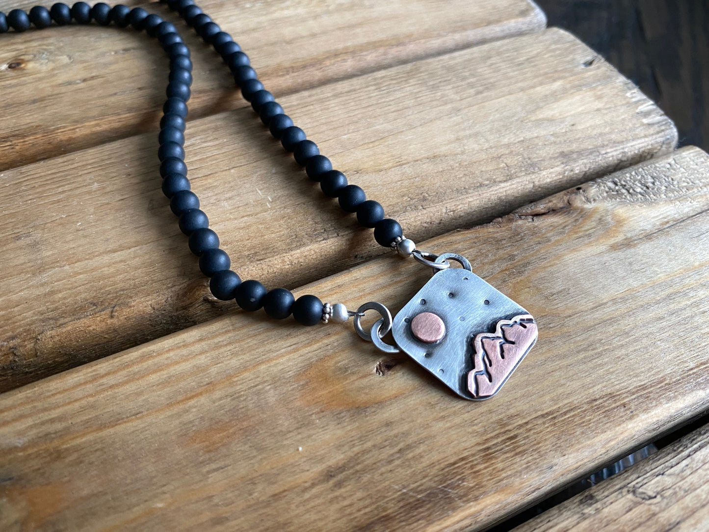 Under the Golden Moon necklace, black onyx necklace with sterling silver and copper mountain scene pendant, mixed metal jewelry